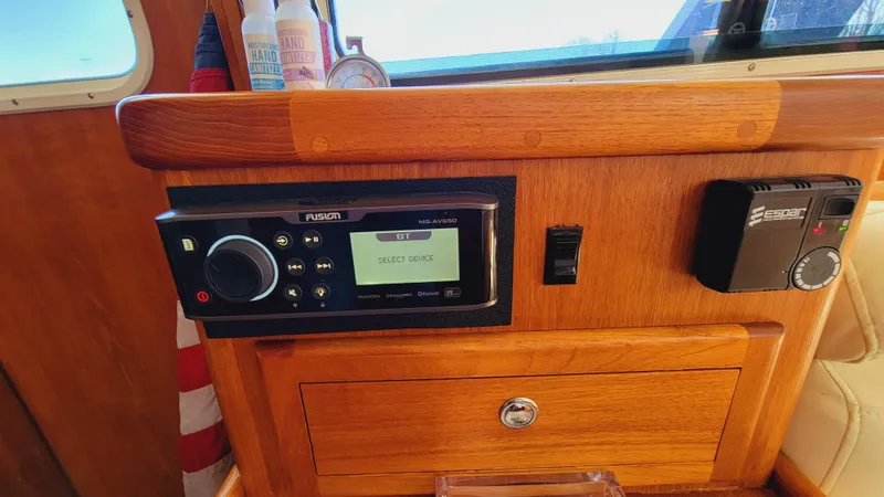 Slide: The Image of Wood-paneled dashboard with Fusion stereo system and controls. - 20