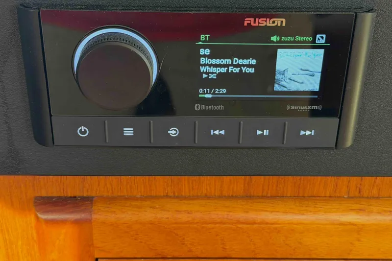 Slide: The Image of Fusion stereo system on a 2003 Pacific Seacraft 38T Fast Trawler, playing music via Bluetooth. - 158