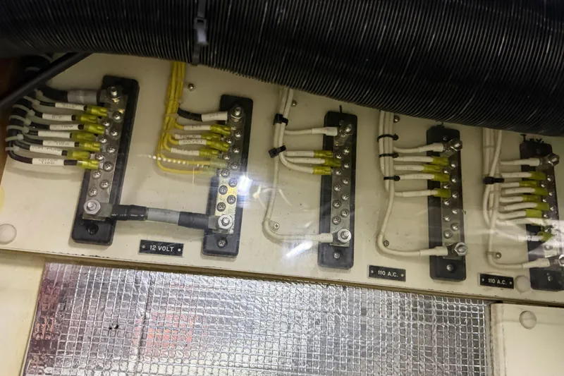 Slide: The Image of Electrical panel of 2003 Pacific Seacraft 38T Fast Trawler with labeled wiring connections. - 139