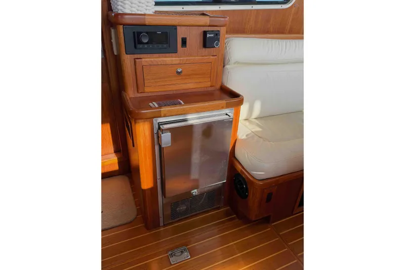 Slide: The Image of Interior of 2003 Pacific Seacraft 38T Fast Trawler with wood cabinetry and compact fridge. - 126