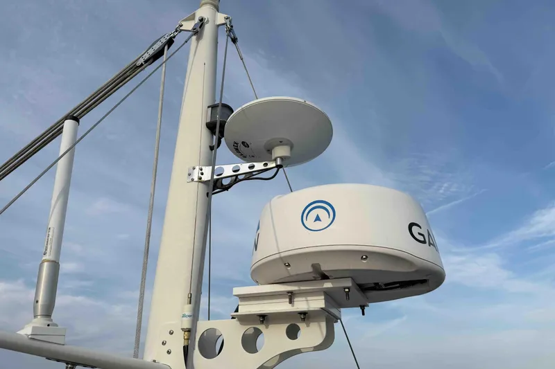 Slide: The Image of Radar equipment on a 2003 Pacific Seacraft 38T Fast Trawler against a clear sky. - 159