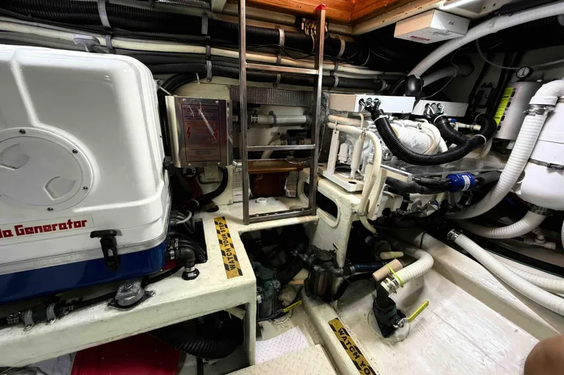 Slide: The Image of Engine room of a 2003 Pacific Seacraft 38T Fast Trawler with generator and machinery. - 149