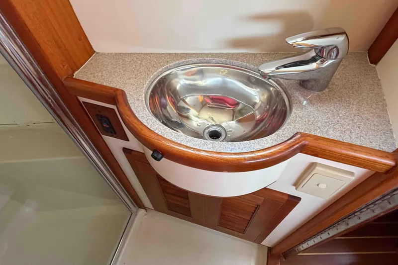 Slide: The Image of Stainless steel sink and faucet in 2003 Pacific Seacraft 38T Fast Trawler bathroom. - 135