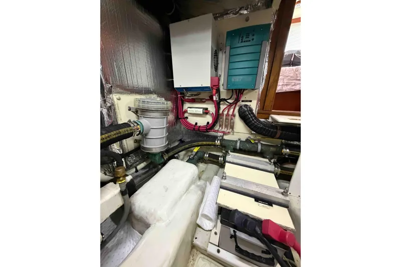 Slide: The Image of Engine room of 2003 Pacific Seacraft 38T Fast Trawler with electrical components and wiring. - 143