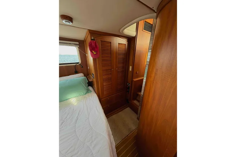 Slide: The Image of Cozy cabin interior of 2003 Pacific Seacraft 38T Fast Trawler with wooden finishes. - 128