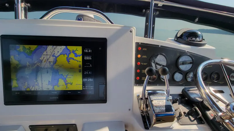 Slide: The Image of The image shows the helm of a 2003 Pacific Seacraft 38T Fast Trawler with a navigation screen. - 41