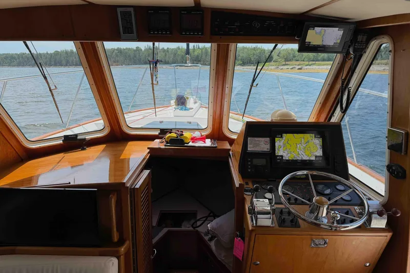 Slide: The Image of Interior view of 2003 Pacific Seacraft 38T Fast Trawler helm with navigation equipment. - 101