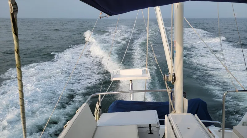 Slide: The Image of A boat speeds across the sea, leaving a white wake behind. - 12