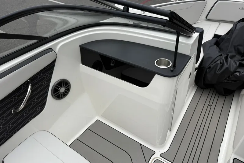 Slide: The Image of 2024 Sea Ray SPX 190 boat interior with sleek seating and modern design features. - 20