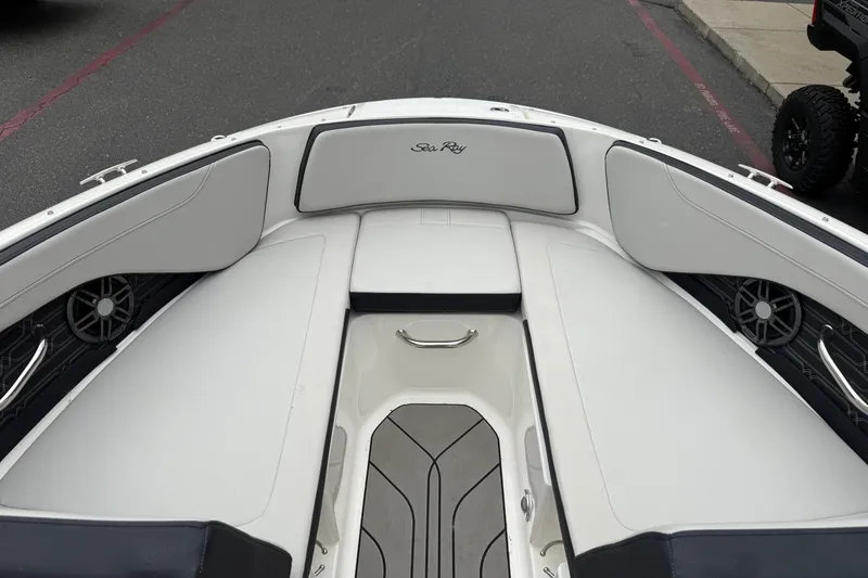 Slide: The Image of 2024 Sea Ray SPX 190 boat interior with white seating and sleek design. - 24