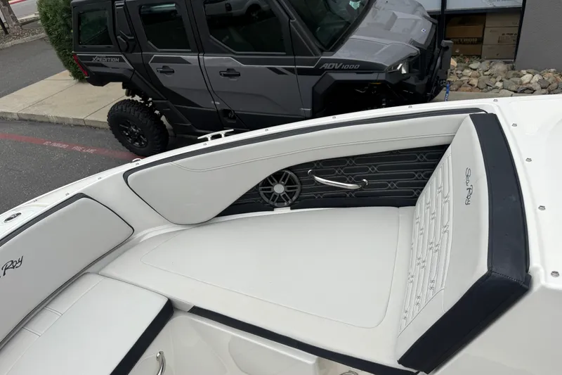 Slide: The Image of 2024 Sea Ray SPX 190 boat interior with white seating and sleek design. - 25