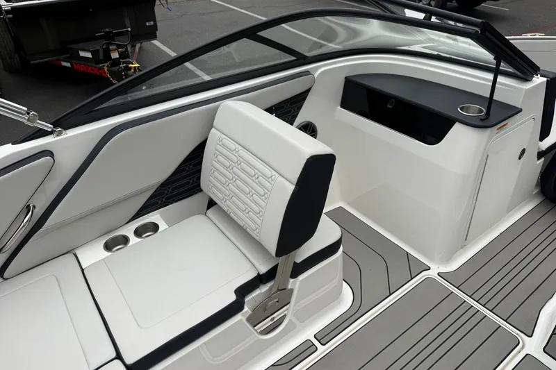 Slide: The Image of 2024 Sea Ray SPX 190 boat interior with white seating and modern design. - 18