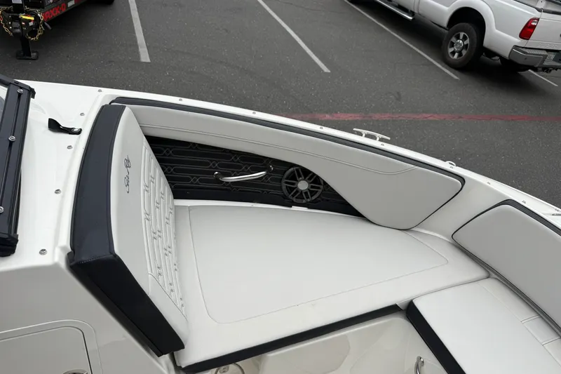 Slide: The Image of 2024 Sea Ray SPX 190 boat interior with white seating and speaker detail. - 23
