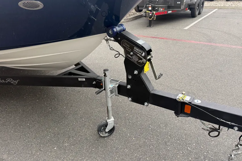 Slide: The Image of 2024 Sea Ray SPX 190 boat trailer hitch and wheel on pavement. - 8
