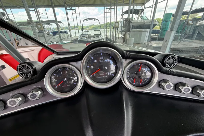 Slide: The Image of Dashboard of a 2017 MasterCraft X23 boat with gauges and controls. - 32