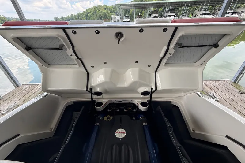Slide: The Image of 2017 MasterCraft X23 boat engine compartment open at dockside. - 38