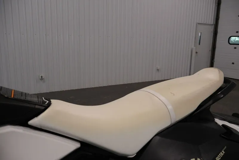 Slide: The Image of 2014 Sea-Doo Spark 3up jet ski seat in a garage setting. - 13
