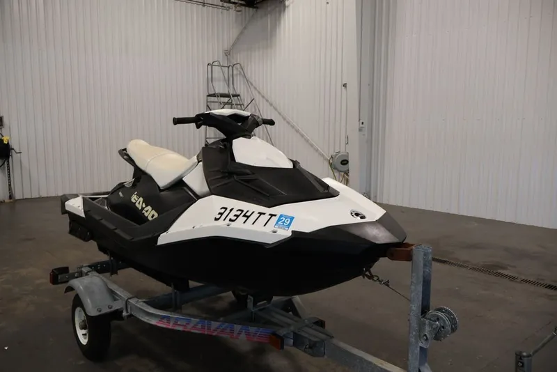 Slide: The Image of 2014 Sea-Doo Spark 3up jet ski on trailer in a garage setting. - 11