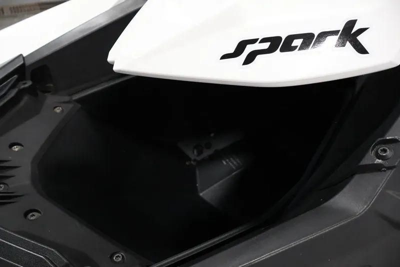 Slide: The Image of 2014 Sea-Doo Spark 3up jet ski storage compartment, featuring sleek design and branding. - 7
