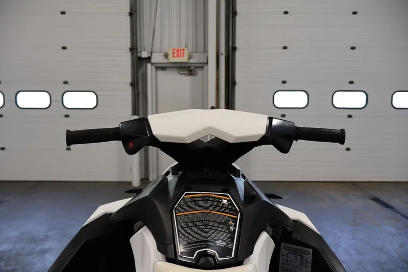 Slide: The Image of 2014 Sea-Doo Spark 3up handlebars in a garage setting. - 14