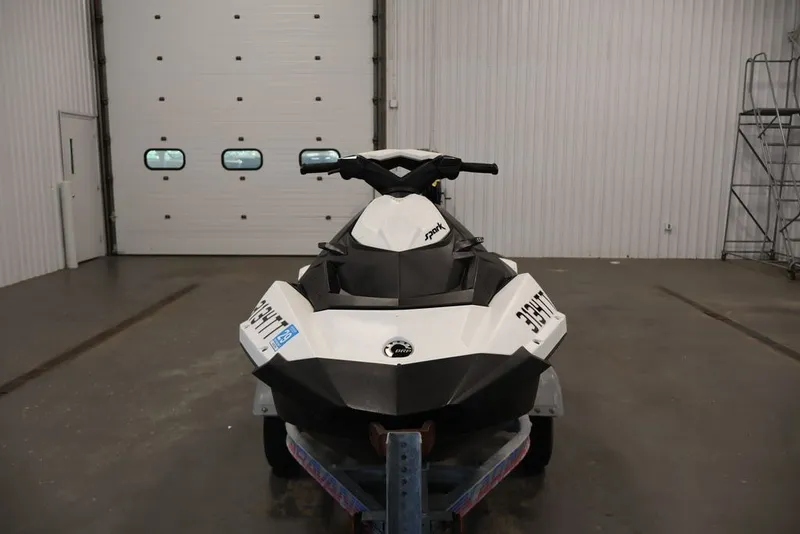 Slide: The Image of 2014 Sea-Doo Spark 3up jet ski in a garage setting. - 2