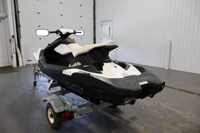 Slide: The Image of 2014 Sea-Doo Spark 3up jet ski on trailer in a garage setting. - 6