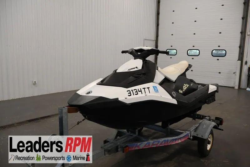 The Image of 2014 Sea-Doo Spark 3up jet ski on trailer in indoor showroom. - 1