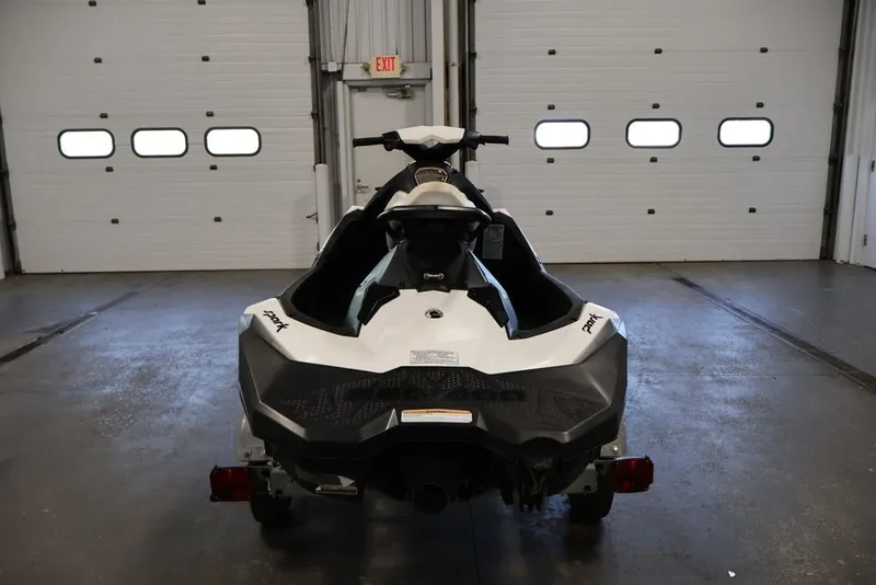 Slide: The Image of 2014 Sea-Doo Spark 3up jet ski in a garage, rear view. - 5