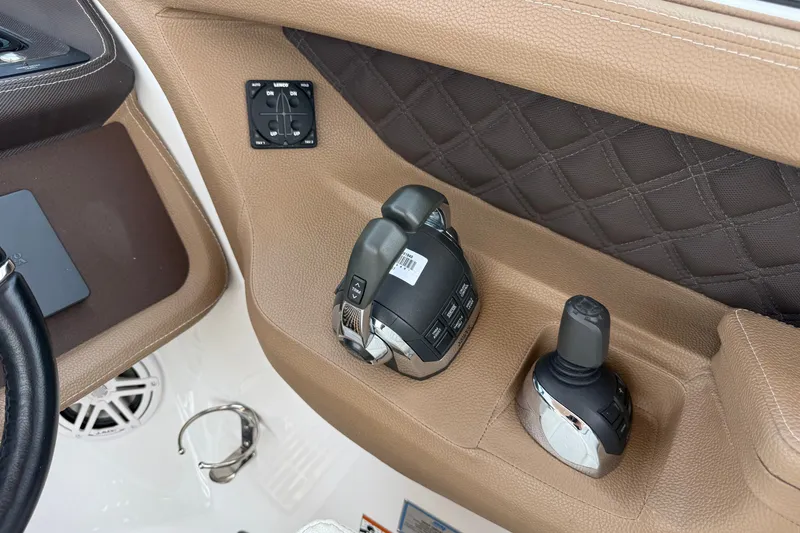 Slide: The Image of Control panel of a 2020 Cobalt R35 boat with joystick and throttle controls. - 13