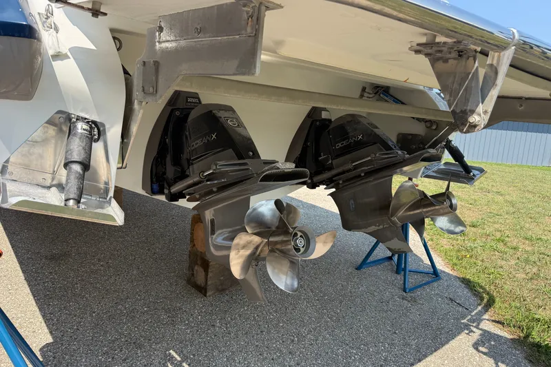 Slide: The Image of 2020 Cobalt R35 boat with dual OceanX outdrives and stainless steel propellers on a trailer. - 21