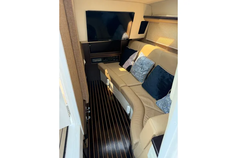 Slide: The Image of Luxurious interior of 2020 Cobalt R35 boat with plush seating and modern TV. - 15