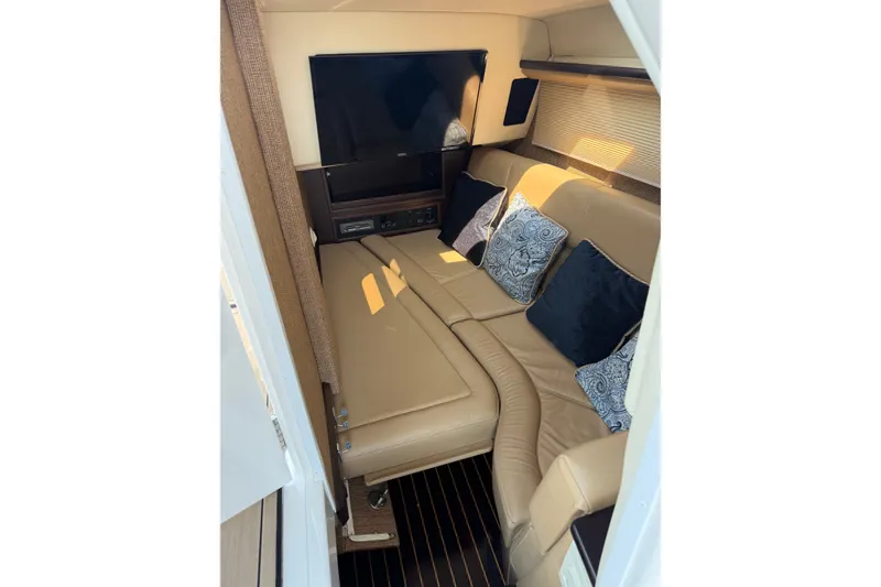 Slide: The Image of Luxurious interior of 2020 Cobalt R35 boat with beige seating and decorative pillows. - 16