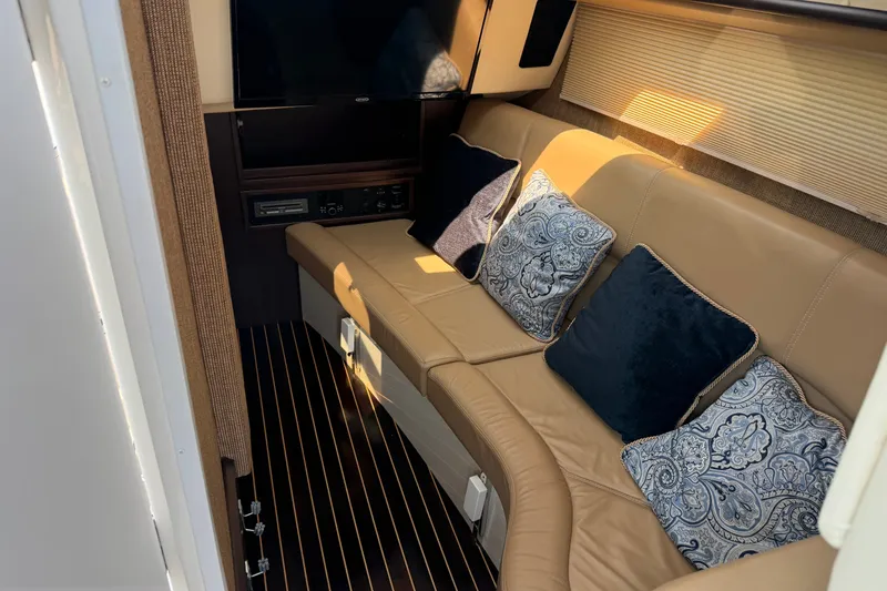 Slide: The Image of Luxurious interior of 2020 Cobalt R35 boat with plush seating and decorative pillows. - 19