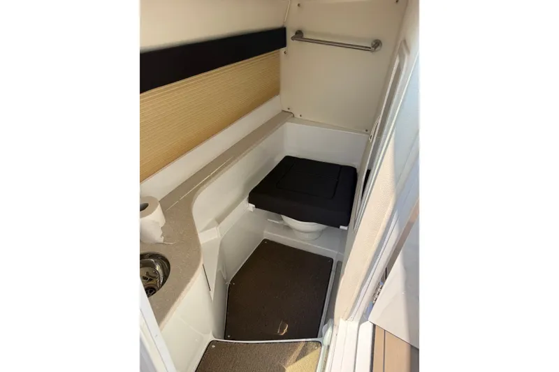 Slide: The Image of Compact bathroom in 2020 Cobalt R35 boat with toilet, sink, and storage. - 17