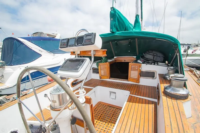 Slide: The Image of 1984 Cheoy Lee Pedrick 41 sailboat cockpit with navigation equipment and wooden deck. - 21