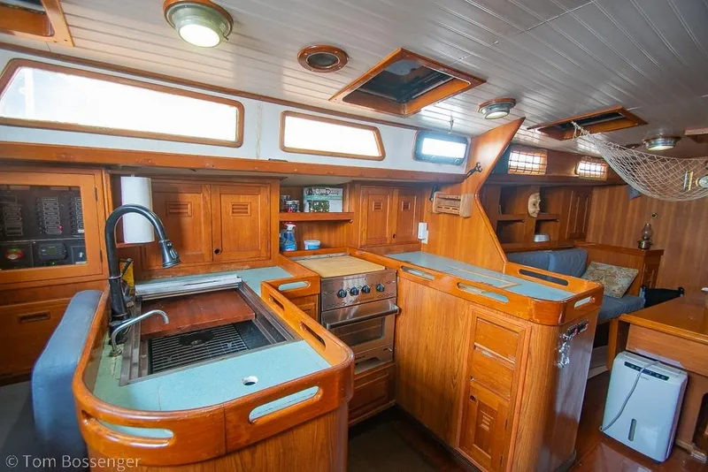 Slide: The Image of Interior of 1984 Cheoy Lee Pedrick 41 yacht with wooden cabinetry and modern amenities. - 8