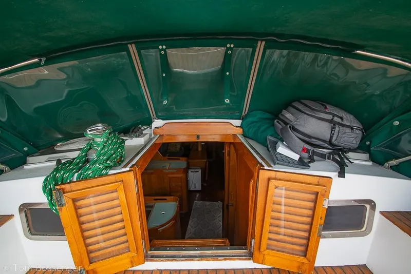 Slide: The Image of 1984 Cheoy Lee Pedrick 41 yacht interior with wooden doors and green canopy. - 6