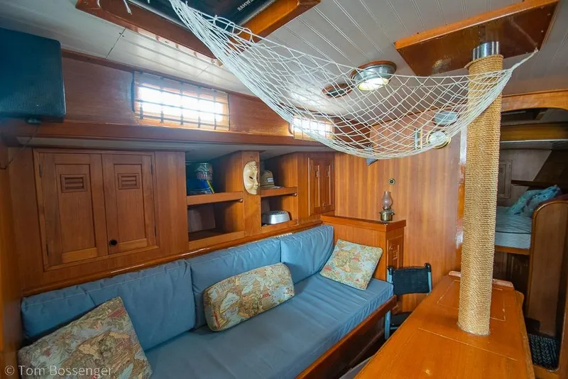 Slide: The Image of 1984 Cheoy Lee Pedrick 41 yacht interior with cozy seating and wooden cabinetry. - 13