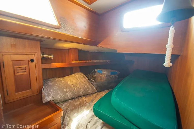 Slide: The Image of Cozy cabin interior of 1984 Cheoy Lee Pedrick 41 sailboat with wooden furnishings. - 16