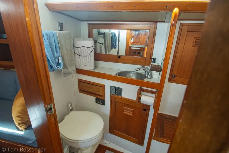 Slide: The Image of 1984 Cheoy Lee Pedrick 41 yacht bathroom with wooden cabinetry and modern amenities. - 18