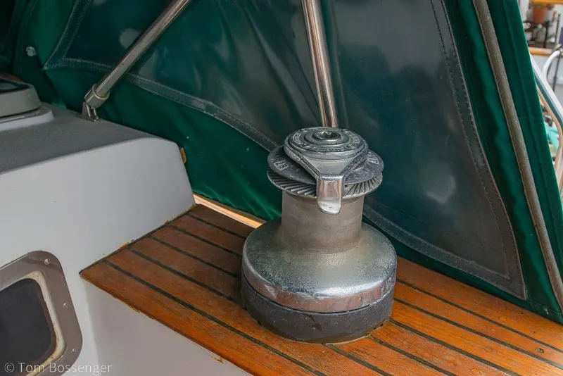 Slide: The Image of Winch on 1984 Cheoy Lee Pedrick 41 sailboat deck with green canopy. - 26