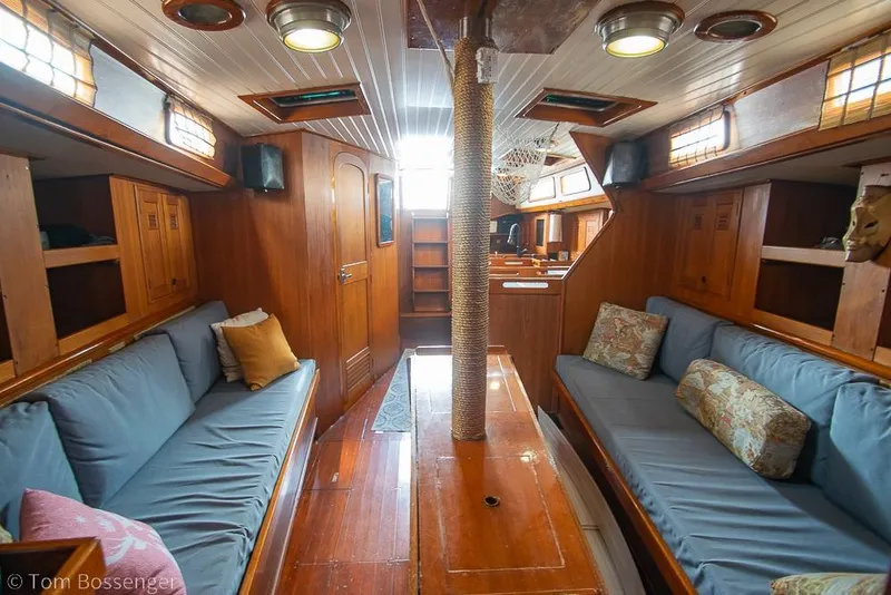Slide: The Image of 1984 Cheoy Lee Pedrick 41 yacht interior with wooden finish and blue seating. - 15