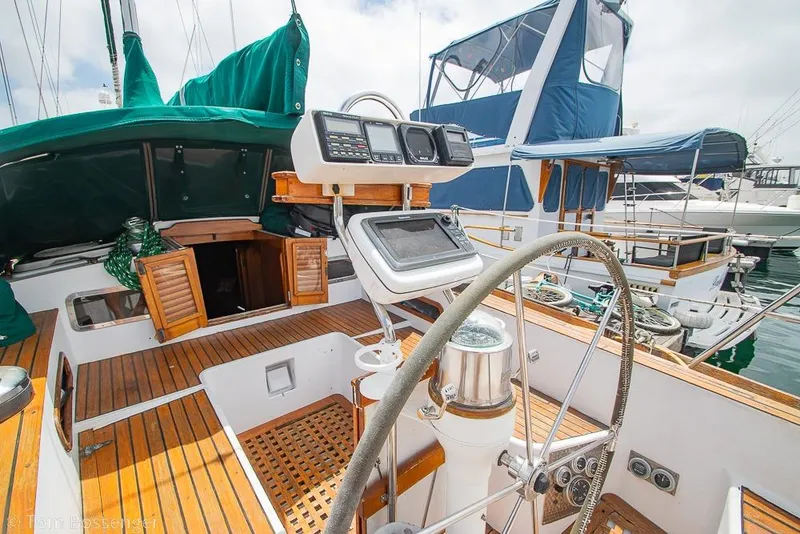Slide: The Image of 1984 Cheoy Lee Pedrick 41 sailboat cockpit with navigation equipment and wooden deck. - 20