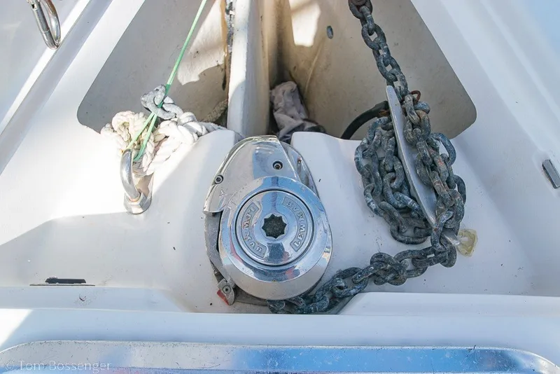 Slide: The Image of Anchor chain and windlass on a 2009 Hunter 50 Center Cockpit sailboat. - 81