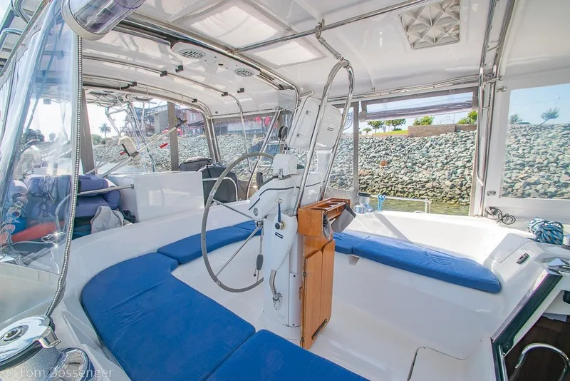 Slide: The Image of 2009 Hunter 50 Center Cockpit interior with blue seating and steering wheel. - 46