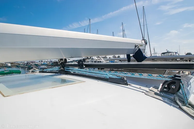 Slide: The Image of 2009 Hunter 50 Center Cockpit sailboat deck with rigging and boom in marina. - 76
