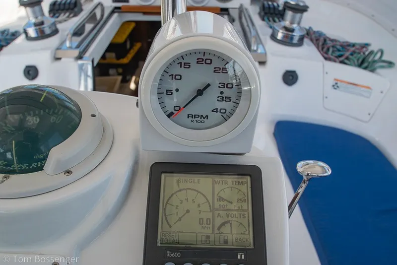 Slide: The Image of Cockpit of 2009 Hunter 50 Center Cockpit sailboat with RPM gauge and navigation instruments. - 52