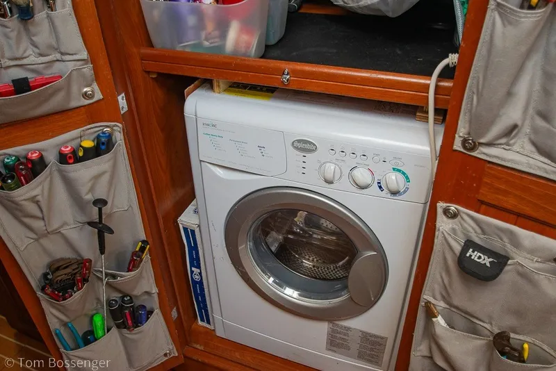 Slide: The Image of Compact laundry area with a Splendide washer in a 2009 Hunter 50 Center Cockpit boat. - 42
