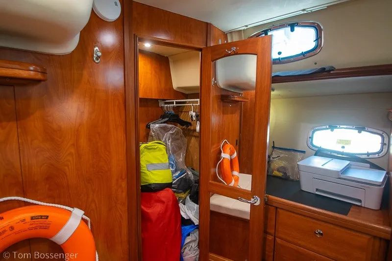 Slide: The Image of Interior of 2009 Hunter 50 Center Cockpit yacht with wooden cabinetry and storage. - 40