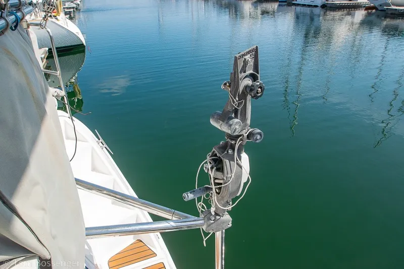 Slide: The Image of Hunter 50 Center Cockpit 2009 sailboat detail with rigging in a marina setting. - 68